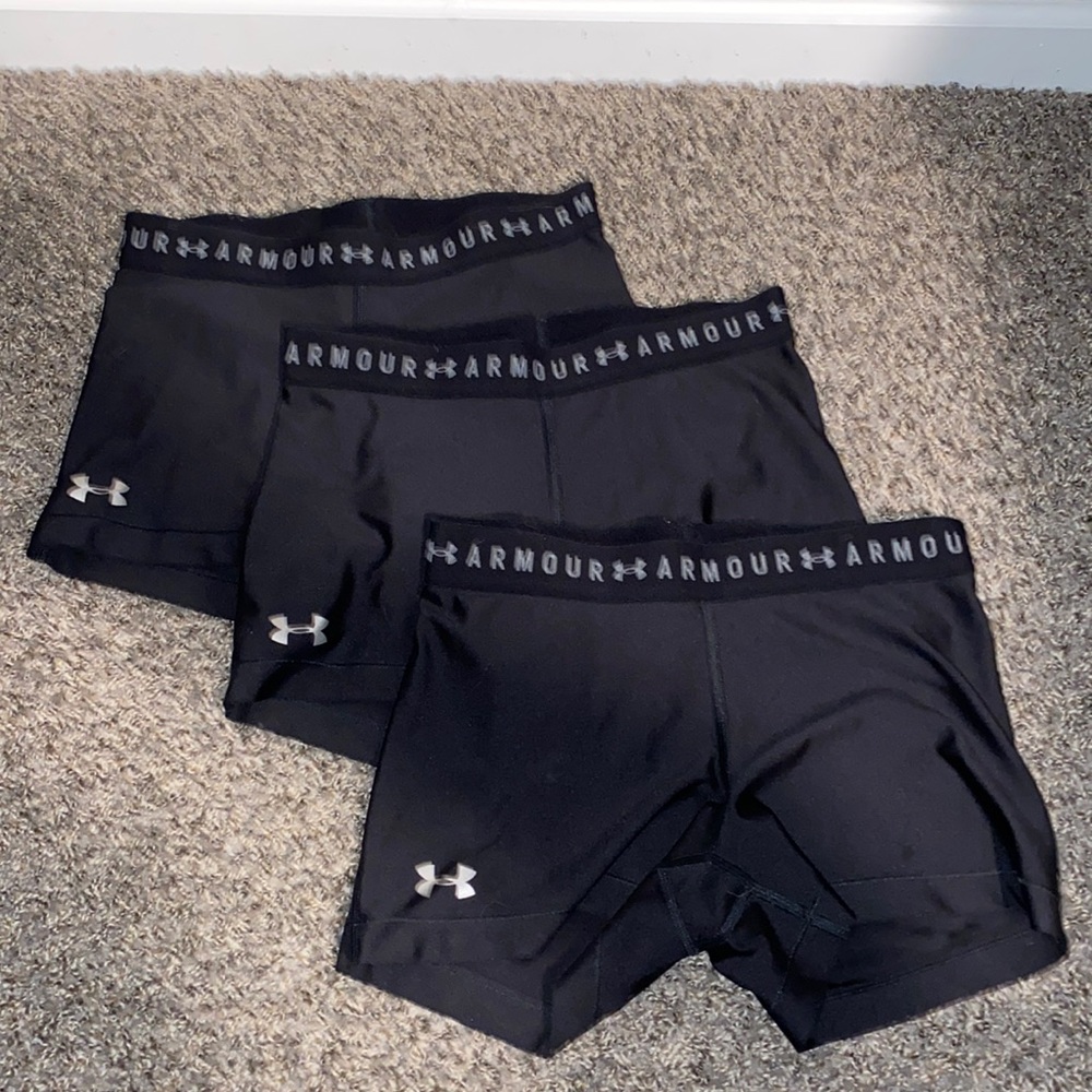 Three pack women’s Under Armour compression shorts. Black size medium.